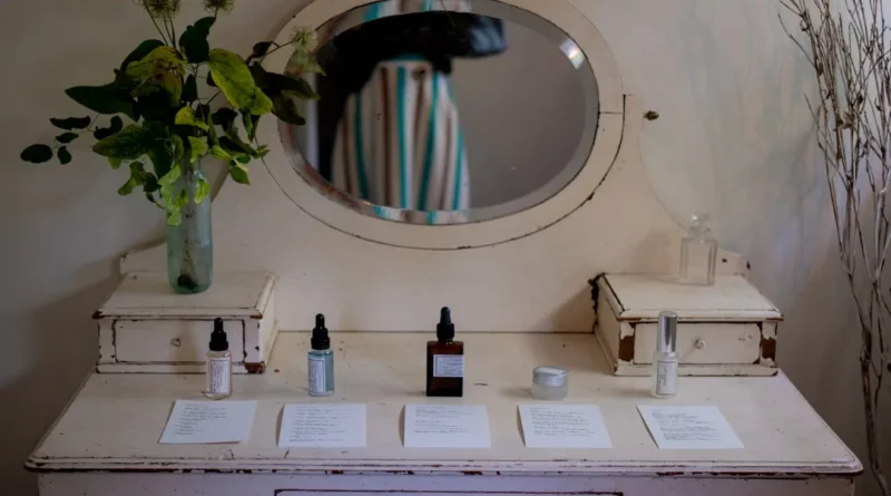 Close-up of a high-end peptide serum dropper bottle on a marble vanity with soft natural lighting
