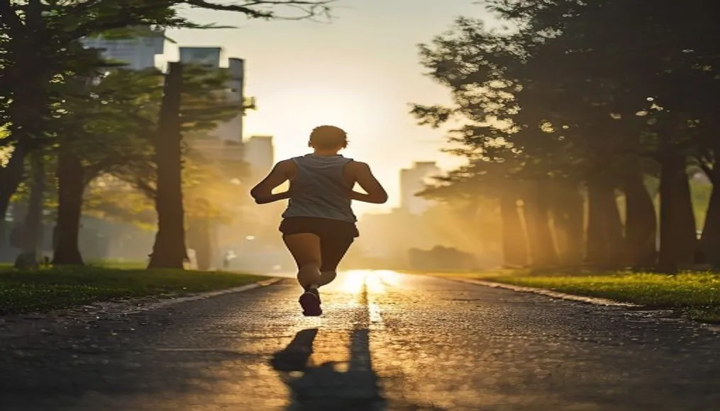 Person jogging in early morning city park