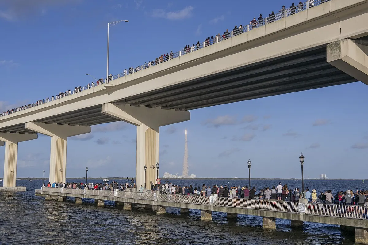 Crowd watching the launch from the beach