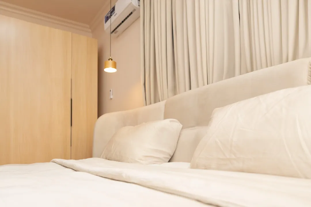 Hero image showing a cozy bedroom with rental versus bought furniture