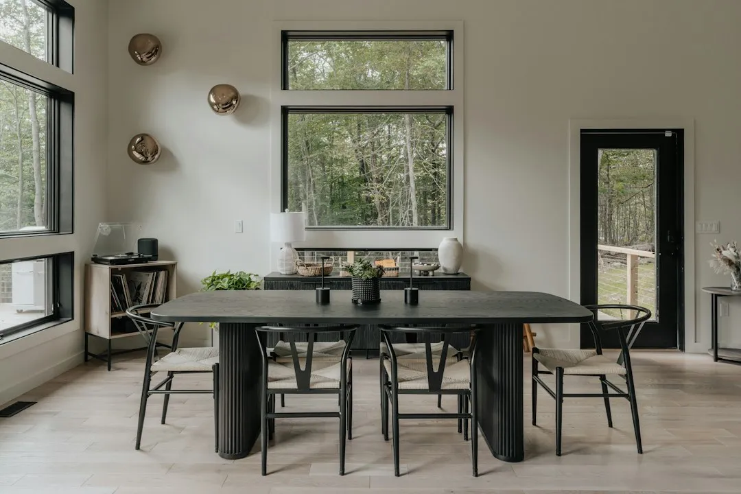 Staged dining area with natural light and minimalist table settings