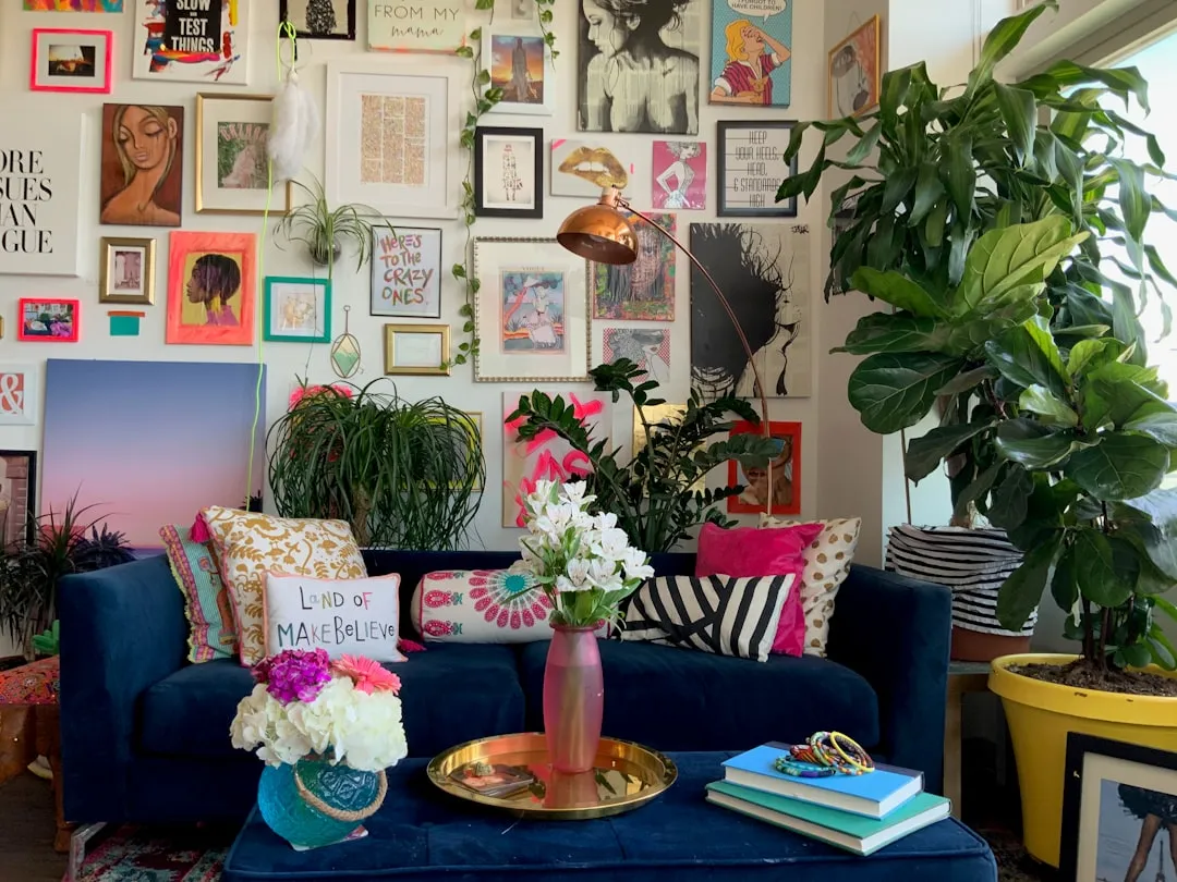 Evenly spaced picture frames on a living room wall using painter tape templates
